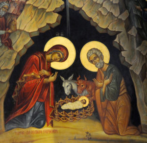 Mary and Joseph kneel at the crib of the infant Christ in this detail of an icon from the Church of the Nativity in Bethlehem. The Dec. 25 Christmas feast commemorates the birth of Christ. The Christmas season begins with the Dec. 24 evening vigil and ends on the feast of the Baptism of the Lord, Jan. 13 in 2008. (CNS photo/Debbie Hill) (Nov. 27, 2007)